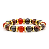 Close-up of natural stone bracelet featuring Tiger Eye Red, Garnet Almandine, and Carnelian.